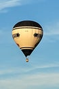 Close-up hot air balloon with a clear sky.