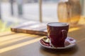 Close up hot art Latte, cappuccino Coffee in red cup on wooden table in Coffee shop blur background with bokeh image Royalty Free Stock Photo