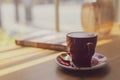 Close up hot art Latte, cappuccino Coffee in red cup on wooden table in Coffee shop blur background with bokeh image process with Royalty Free Stock Photo