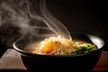 close-up of hot bowl of ramen with steam rising and curly noodles visible Royalty Free Stock Photo