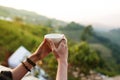 Hot drink coffee or tea on woman hand in the morning at outdoor cafe Royalty Free Stock Photo