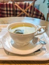 Hot herbal tea in white ceramic cup for afternoon time Royalty Free Stock Photo