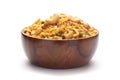 Close-Up of Hot spicy Kashmiri Mixture Namkeen snacks In hand-made handcrafted wooden bowl made with dry fruits, peanuts,. Royalty Free Stock Photo