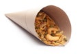 Close-Up of Hot spicy Kashmiri Mixture Namkeen snacks In handmade handcraft brown paper cone bag made with dry fruits,