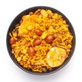 Close-Up of Hot spicy Nav Ratan snacks in a black Ceramic bowl, made with red chili, peanuts. Indian spicy snacks Namkeen, Royalty Free Stock Photo