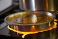 close-up of a hotplate, with the bubbling maple sap being boiled down into syrup