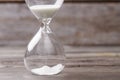 Close-up hour glass with white sand. Royalty Free Stock Photo