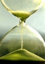 Close up hourglass counting down time with sand view Royalty Free Stock Photo