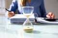 Close-up Of A Hourglass On Desk Royalty Free Stock Photo