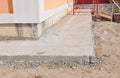 Close up on house foundation waterproofing, damp proofing with concrete path to avoid water leaks for house wall. Royalty Free Stock Photo