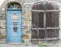 Close up of a house front with blue and brown wooden door