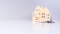 close-up house keys against the background of wooden house models. selective focus. investment, mortgage, real estate