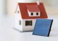 Close up of house model and solar battery or cell