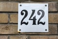 A Close Up House Number 242 At Amsterdam The Netherlands 19-3-2023 Royalty Free Stock Photo