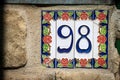 House Number 98 on the wall - Liguria Italy Royalty Free Stock Photo