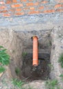 Close up on house septic drainage pipe in home foundation. Drain system