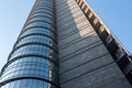 Close-up of a huge multi-story modern office building against a blue sky. 01.2020 Milan. Royalty Free Stock Photo