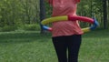 close-up hula hoop exercises belly outdoor, hula-hoop twirling for weight loss