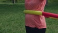 close-up hula hoop exercises belly outdoor, hula-hoop twirling for weight loss