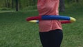 close-up hula hoop exercises belly outdoor, hula-hoop twirling for weight loss