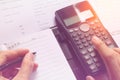 Close-up of Human accountant making calculations while sitting at desk in office Royalty Free Stock Photo