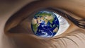 Close-Up Of A Human Eye With The Earth Reflected In Its Iris, Symbolizing Vision And Global Awareness