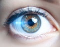 Close-up of human eye with subtle digital HUD reflection, iris scanning technology for cybersecurity and biometric identity Royalty Free Stock Photo