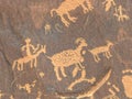 Close up of a human figure hunting sheep on newspaper rock, utah Royalty Free Stock Photo