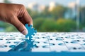 Close up of human hand assembling jigsaw puzzle. Business solution concept Royalty Free Stock Photo