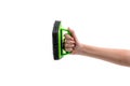 Human hand holding a green plastic scrubber isolated on white background Royalty Free Stock Photo