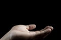 Close-up human hand on isolate black background. Royalty Free Stock Photo