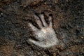 Close up human hand print on the soil ground g Royalty Free Stock Photo