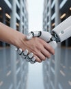 Close up of a human hand shaking a white robotic hand in a modern office setting handshake Royalty Free Stock Photo