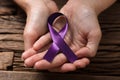 Human Hand Showing Violet Ribbon To Support Breast Cancer Cause Royalty Free Stock Photo