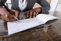 Human Hand Signing Cheque Royalty Free Stock Photo
