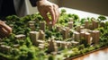 Close-up of human hand touching model of city on the table Generative AI