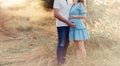 Close up of human hands holding pregnant belly, closeup happy family awaiting baby, standing on green grass, body part, young fami Royalty Free Stock Photo
