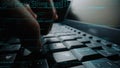 Close-Up of Human Hands Typing on Computer Keyboard with Programming Code and Digital Data in Background for Technology Royalty Free Stock Photo