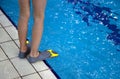 Close up human legs swimmer fins near pool Royalty Free Stock Photo