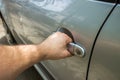 Close up of human male hand opening car door Royalty Free Stock Photo