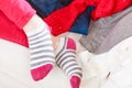 Close up of human woman feet in striped socks.