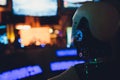 Close-up of humanoid robot head with micro-cameras eyes on blurred background.