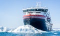 Close up of the Hurtigruten icebreaking cruise ship the MS Fridtjof Nansen in amongst icebergs in Ilulissat, Greenland