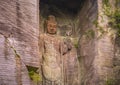 Close-up on the Hyaku-shaku kannon buddha carved in Mount Nokogiri stone quarry.