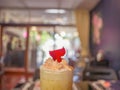 Close up Ice Coffee topping with whip cream and Rose leaf