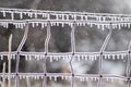 Close up of ice covers wire fence with ice icicles Royalty Free Stock Photo