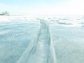 Close-up of ice crack surface; and horizon and blue sky behind