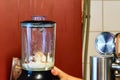 Blender with of ice cream close. Preparing smoothie