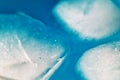 A close up of ice cubes in a blue liquid Royalty Free Stock Photo