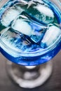 Close up of ice in drink in blue curacao colored drink Royalty Free Stock Photo